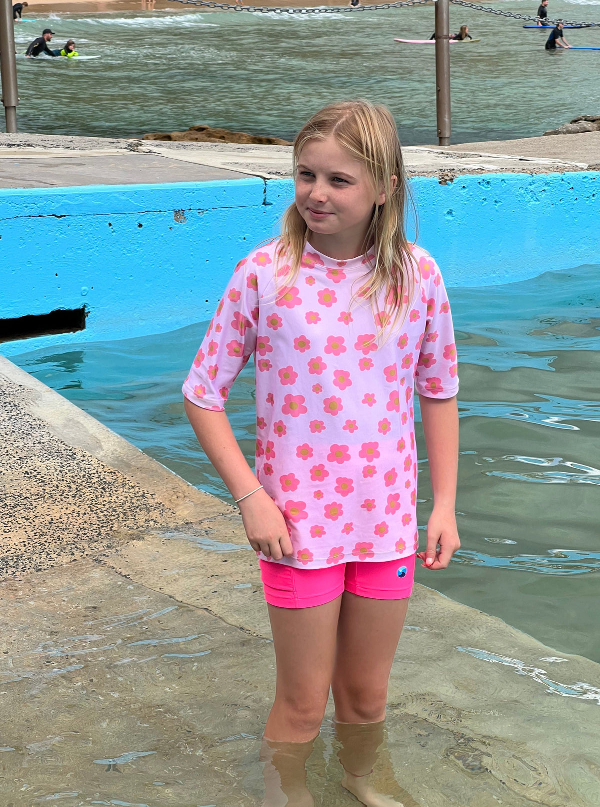 Carla Dinnage (Limited Edition) Pink Daisy - Rashie (Girls) Rashie - Back Beach Rd